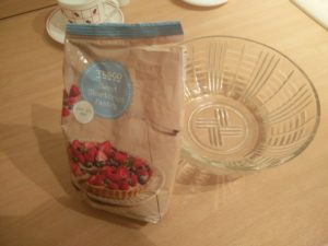 Shortcrust pastry mix in a packet next to a bowl