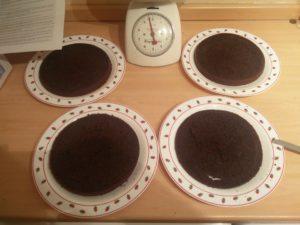 All 4 of the cake parts on separate plates