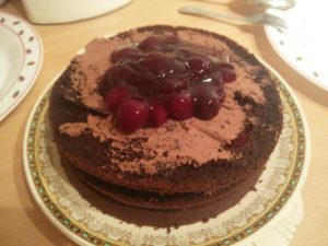 Cherries added to the third layer of the cake
