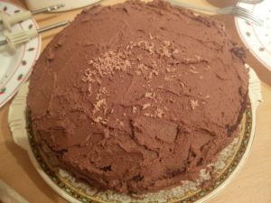 The first few shavings of chocolate on top of the cake