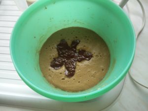 The melted chocolate in a starfish shape, with the egg, butter and sugar mix