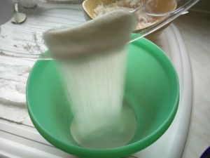 Sugar being poured from the scales to the mixing bowl