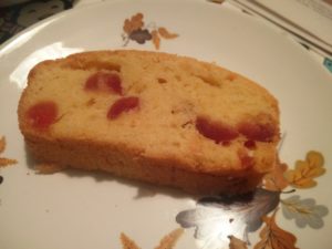 A slice of the cherry cake from the large of the two cakes