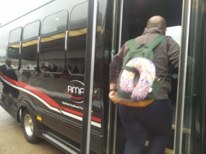 A member of staff boarding the minibus we would be using