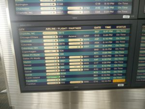The departures board showing our flight, along with many others