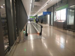 A travelator and corridor to the departures lounge