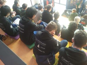 Our team of students sitting in the auditorium during the lunchtime talks