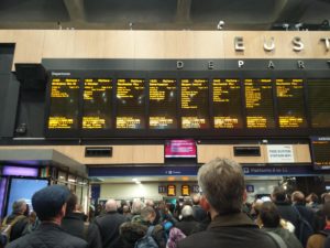 The departures boards showing a few trains and platforms